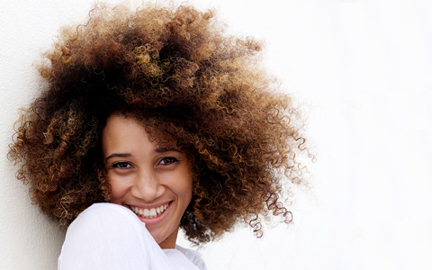 Patient smiling after a dental bonding treatment.