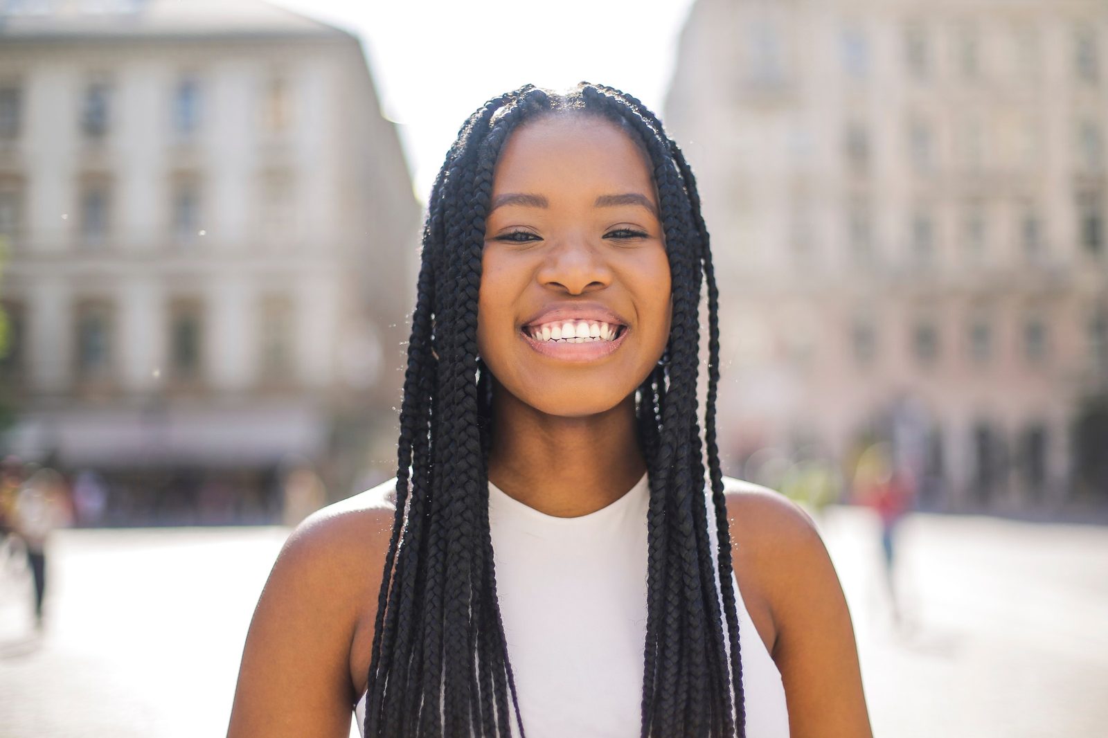 Smiling woman outdoors in soft sunlight