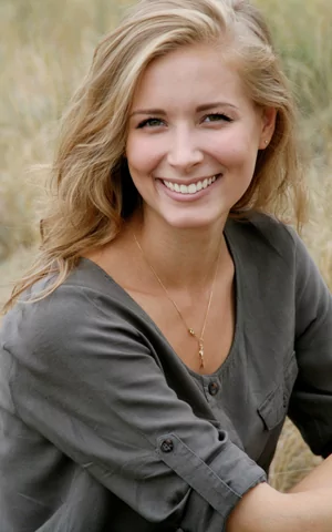 Person smiling, illustrating the link between oral and overall health.
